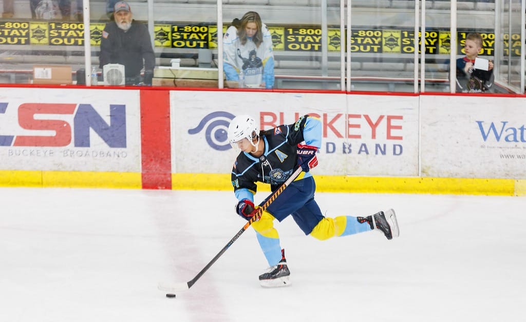 Thomas Bird of the Toledo Warriors skates with the puck.