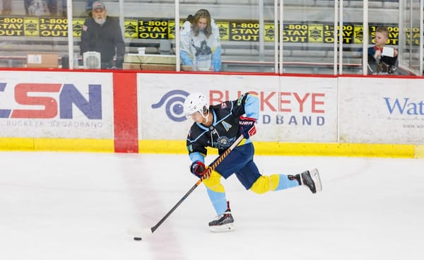 Thomas Bird of the Toledo Warriors skates with the puck.